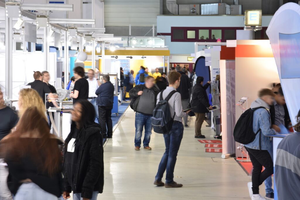View of Career Fair down middle of row with booths on both sides.